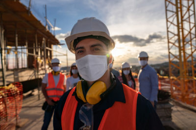 Portrait of a happy construction worker at a building site