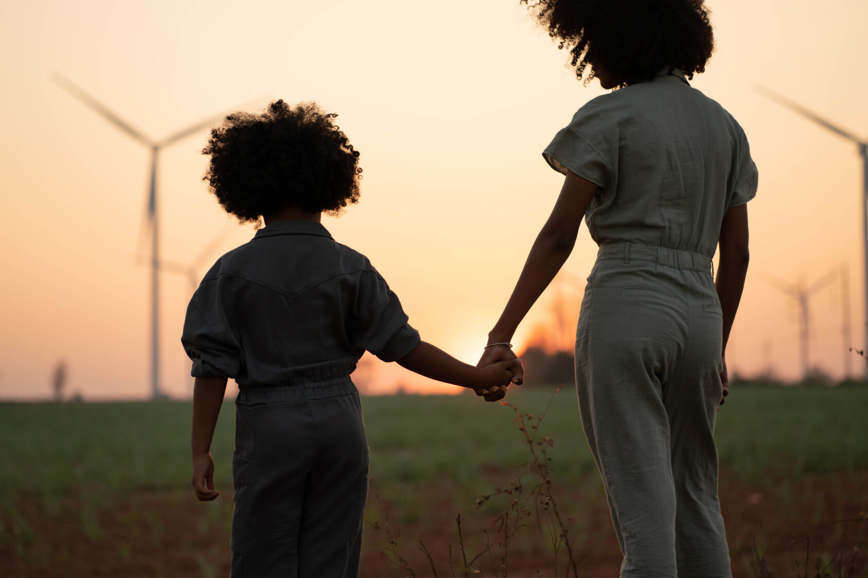 two people looking at windmills